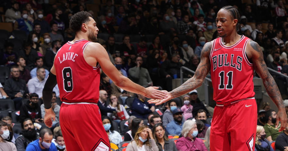 TORONTO, CANADA - OCTOBER 25: Zach LaVine #8 of the Chicago Bulls high fives DeMar DeRozan #11 of the Chicago Bulls during the game against the Toronto Raptors on October 25, 2021 at the Scotiabank Arena in Toronto, Ontario, Canada.  NOTE TO USER: User expressly acknowledges and agrees that, by downloading and or using this Photograph, user is consenting to the terms and conditions of the Getty Images License Agreement.  Mandatory Copyright Notice: Copyright 2021 NBAE (Photo by Mark Blinch/NBAE via Getty Images)